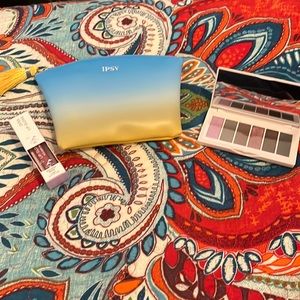 Ipsy bag with eyeshadow palette and lip gloss never used.